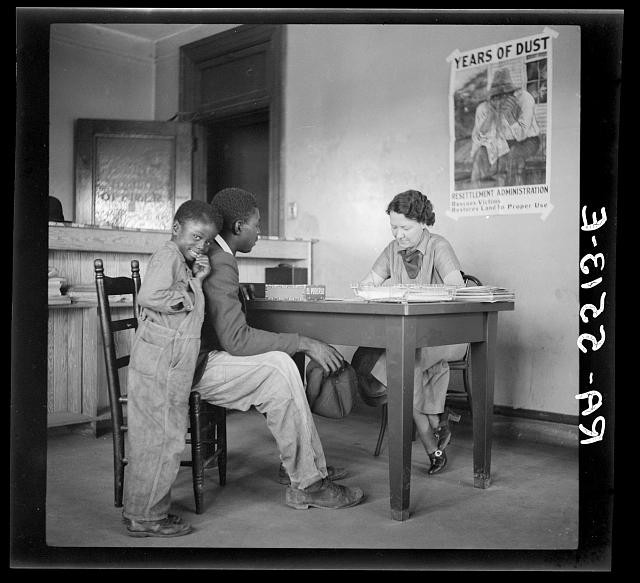 Smithfield North Carolina 1936 Rehabilitation Client Repays Loan at Desk