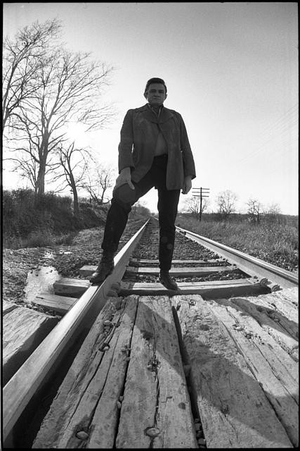 Photo:Johnny Cash 1960s Railroad Tracks Pose on Train Trestle