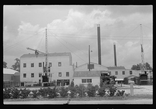 Photo:1930s Industrial Plant Crane Smokestacks Factory Building