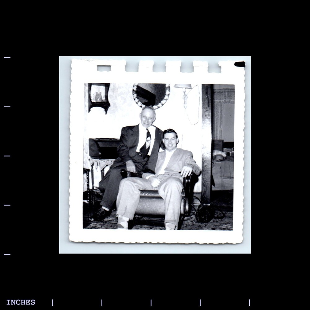 Old Square Photo MEN SITTING ON CHAIR IN LIVING ROOM