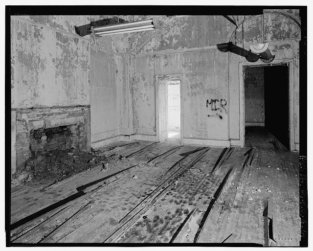 64. Interior view, first-floor room extending between the north wall of the