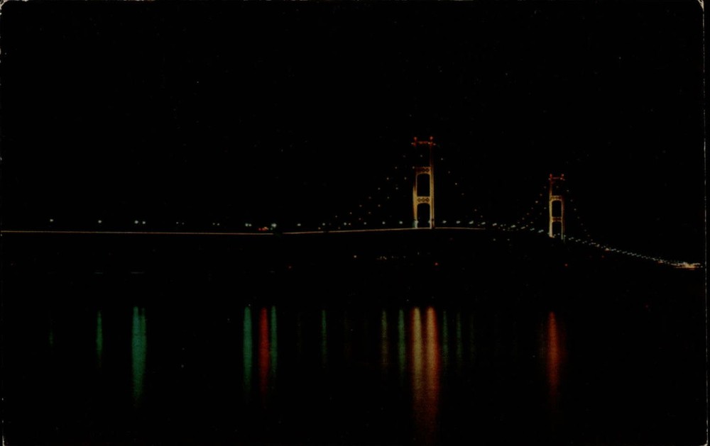 Michigan Mackinac Bridge at night lights ~ 1950-60s vintage postcard