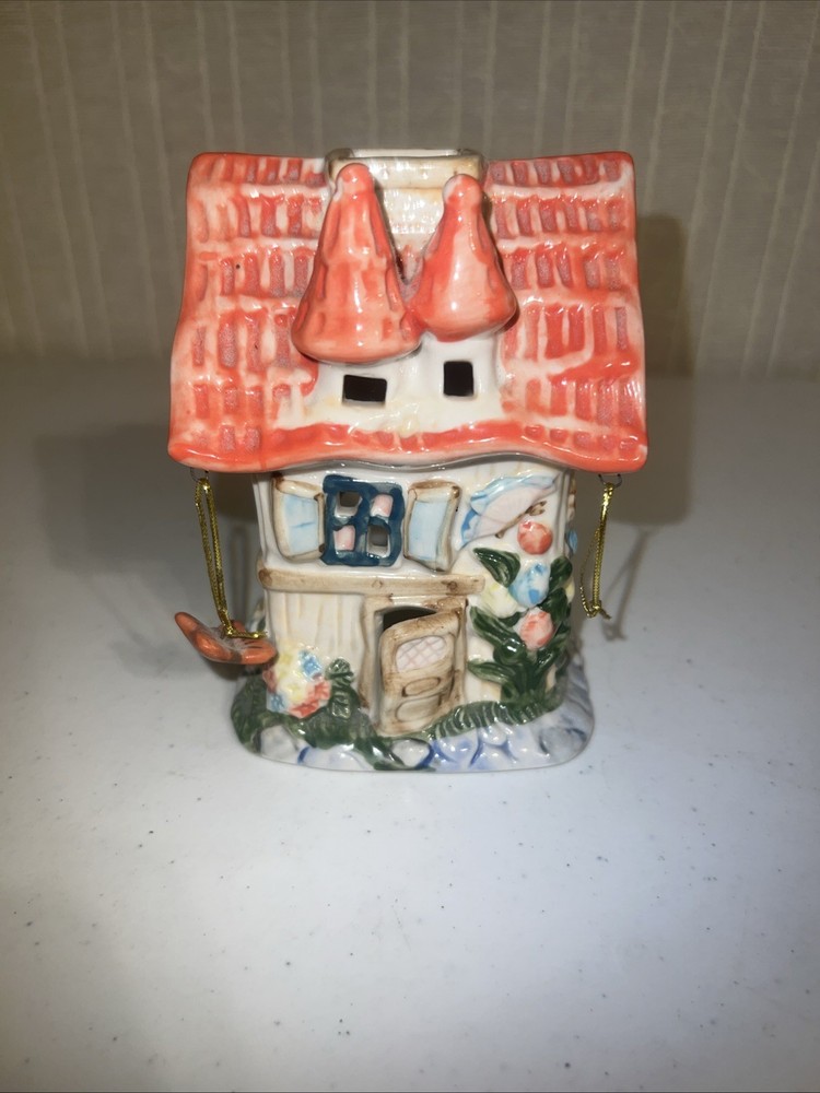 vintage ceramic cottage or fairy house tealight candle holder.