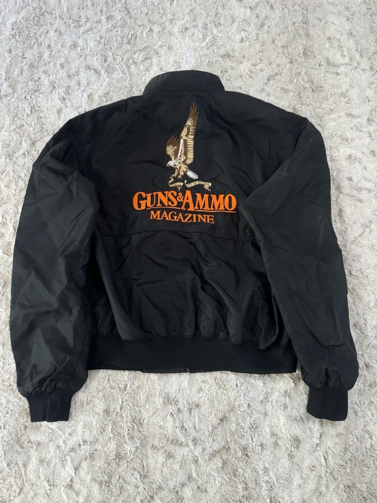 VTG 80s GUNS AND AMMO JACKET, MAGAZINE, ZIP UP BOMBER STYLE, BLACK. SIZE MED/L