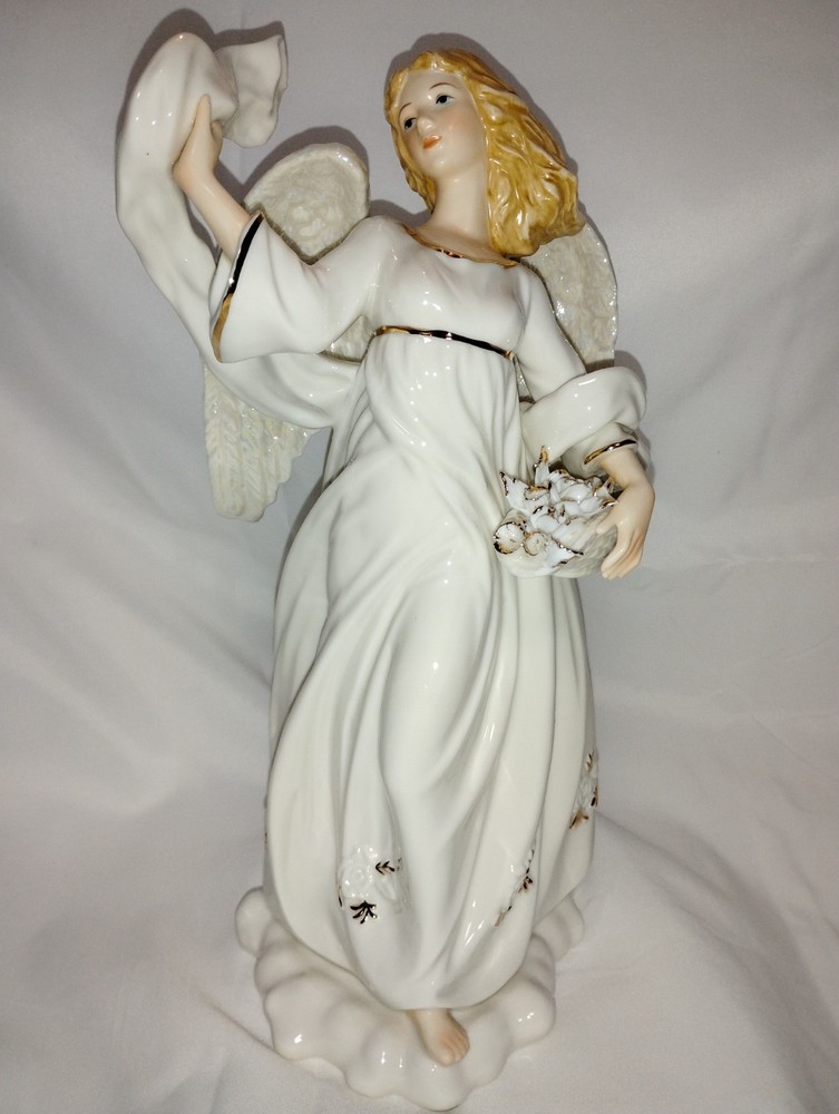 Fine Porcelain Angel Figurine Holding a Basket