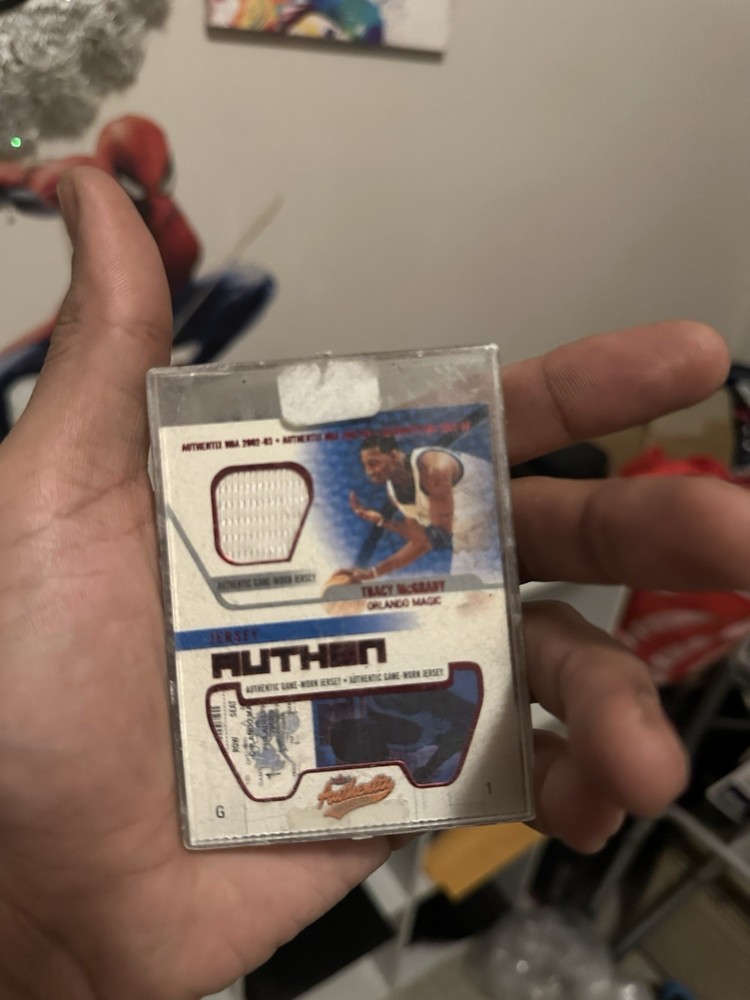 2002-03 Fleer Authentix - Jersey Authentix Tracy McGrady #JA-TM Ripped (MEM)