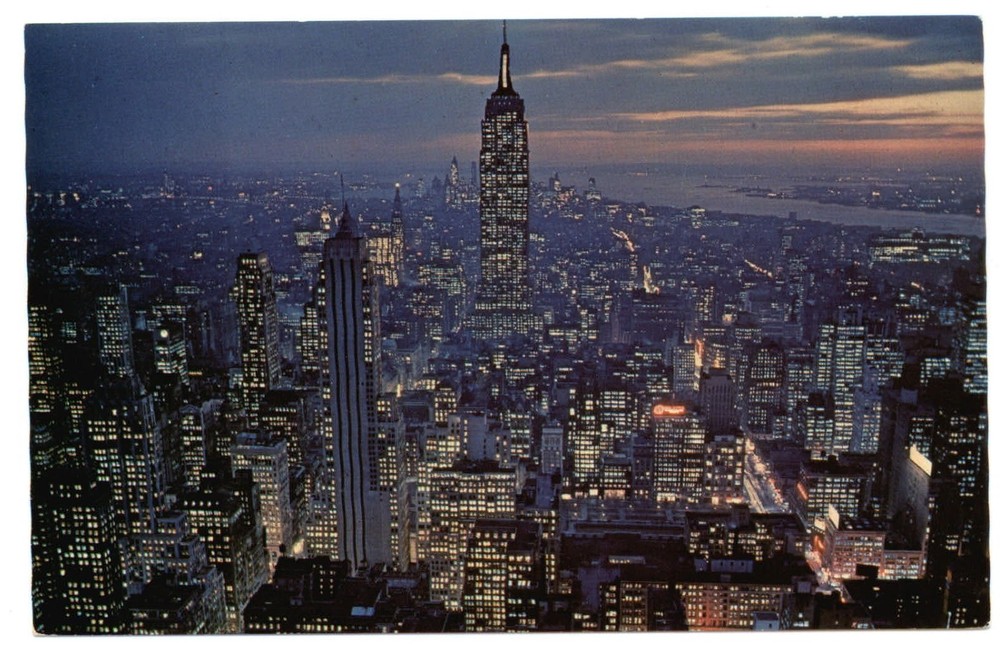 New York City NY Manhattan night view sunset aerial vintage 1960s postcard
