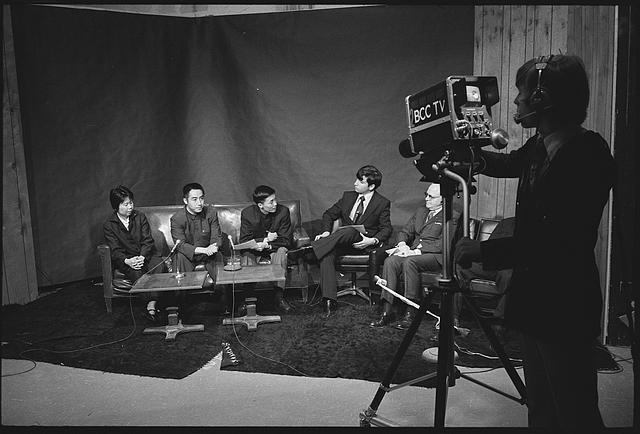 Members of a Chinese table tennis team being interviewed at a television studio