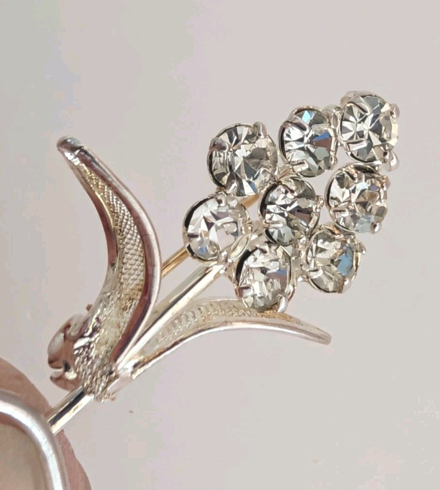 Vintage Rhinestone Floral Brooch Pin With Filigree Leaves In Silvertone
