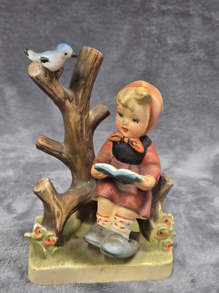 VTG JAPAN BISQUE LITTLE GIRL SITTING ON TREE W/BOOK AND BIRD FIGURINE. Read**40