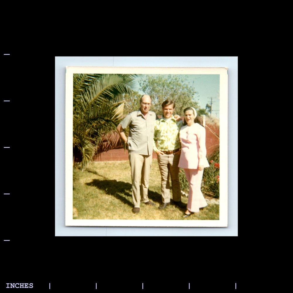 Square Color Photo MEN WOMAN STANDING IN YARD
