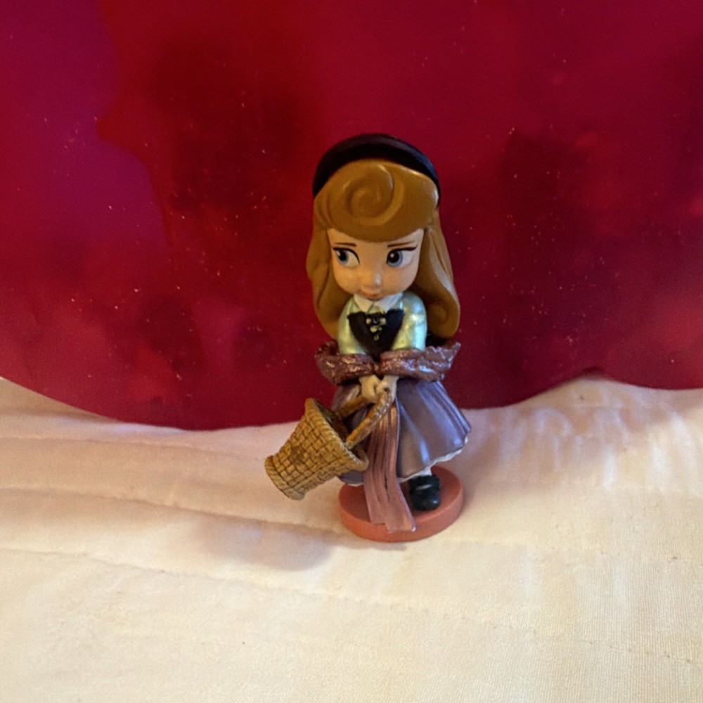 Disney Animators' Collection toddler Aurora figurine in her Briar Rose outfit.