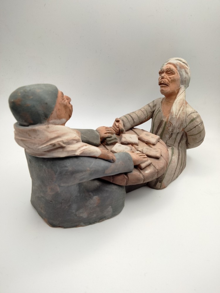 Handmade clay sculpture of two elderly men playing dominoes, unique one-of-a-kind art piece