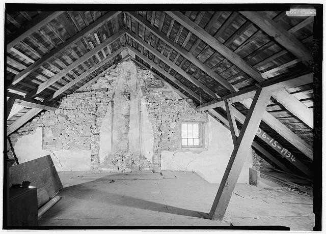 25. Interior view of northeast gable end in attic to show framing and remains