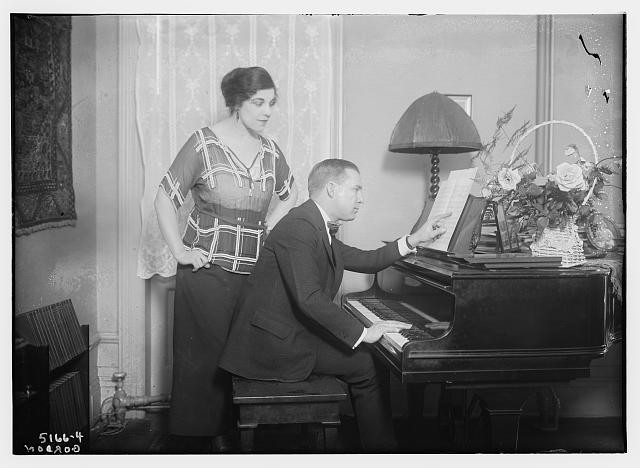 Gordon,pianos,sheet music,women,men,instruments,flowers,bench,Bain News Service