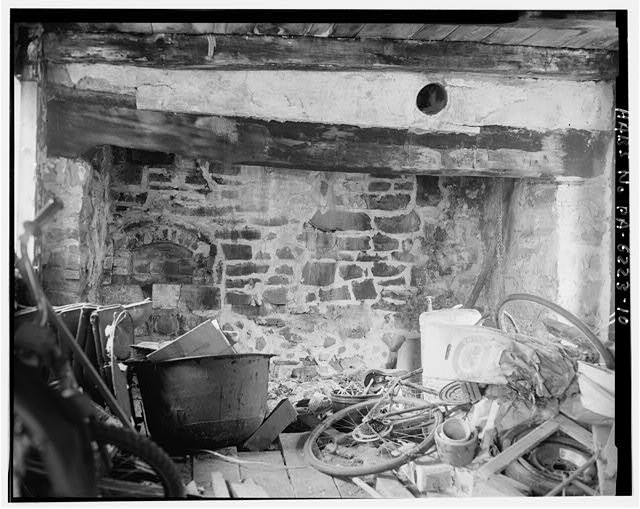 10. Interior view of first floor fireplace stone and wall (view to the east,