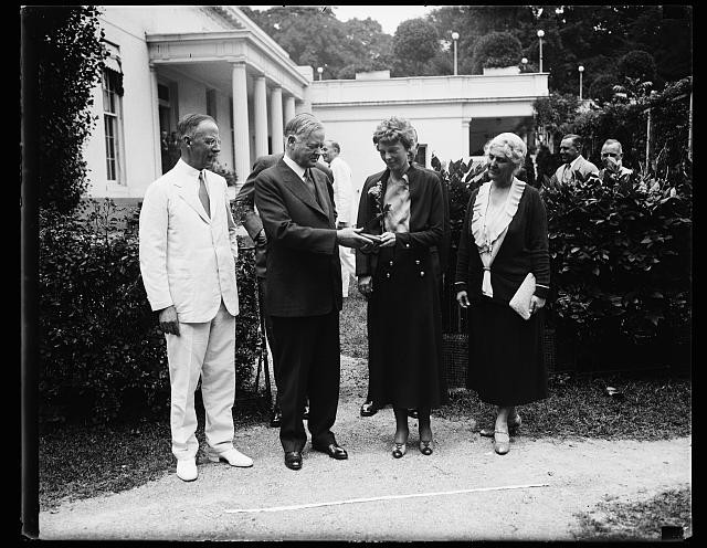Herbert Hoover presenting the National Geographic Society medal to Amelia