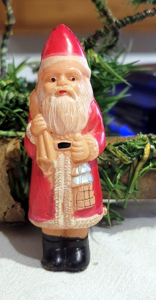 Miniature Celluloid  Santa Claus, holding Lantern. With Pack of  Toys. Japan