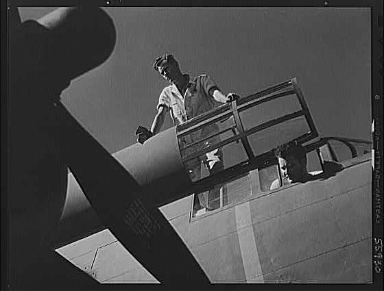 Photo:WWII U.S. Air Force Pilot Standing on Bomber Wing Aircraft 1940s