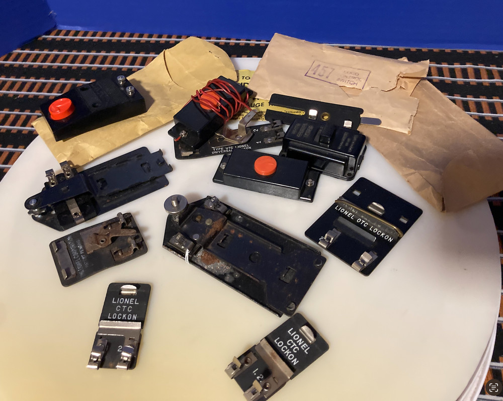 Lionel O Gauge Lot of Lock on's,control switches and misc.#153C Fair Condition