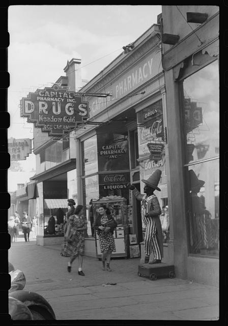 Capital Pharmacy Drugs storefront sidewalk women 1930s liquor Coca Cola sign