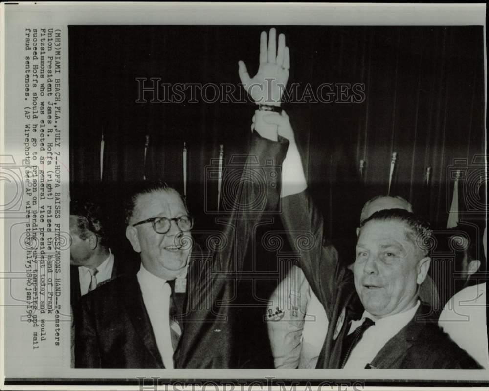 1966 Press Photo James Hoffa raises hand of Frank Fitzsimmons at Florida meeting