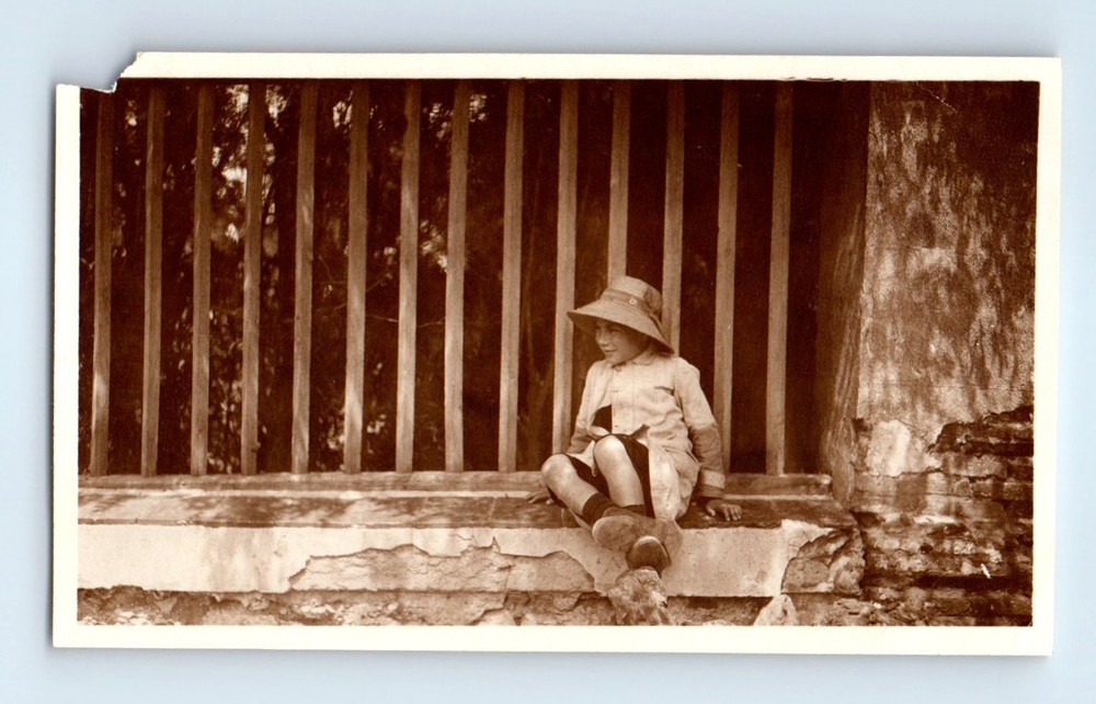 Old Vintage Photo SOLO BOY IN HAT SITTING BY FENCE ANTIQUE SNAPSHOT PICTURE