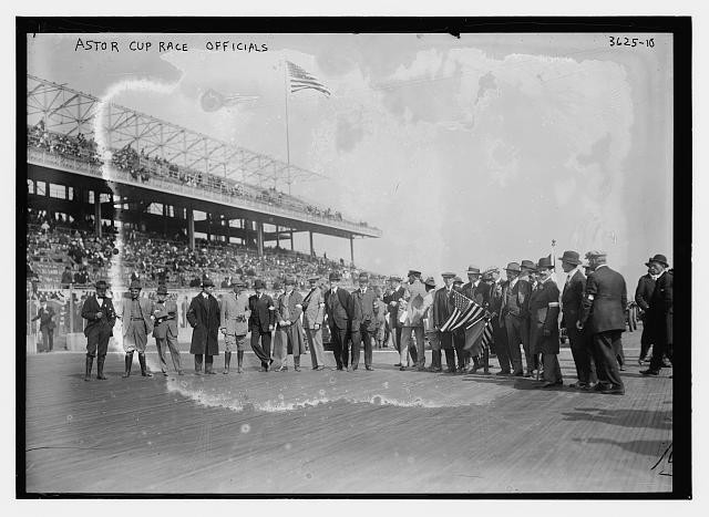 Astor Cup race officials,American flags,spectators,automobile racing,Bain News