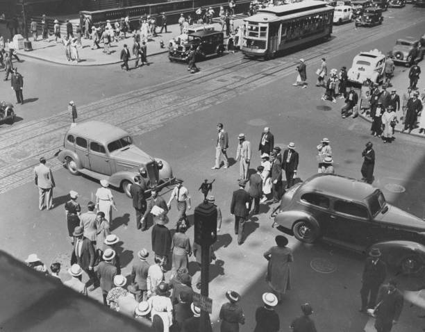People jaywalking in light traffic at Fifth Ave And 42nd St  .. Old Photo