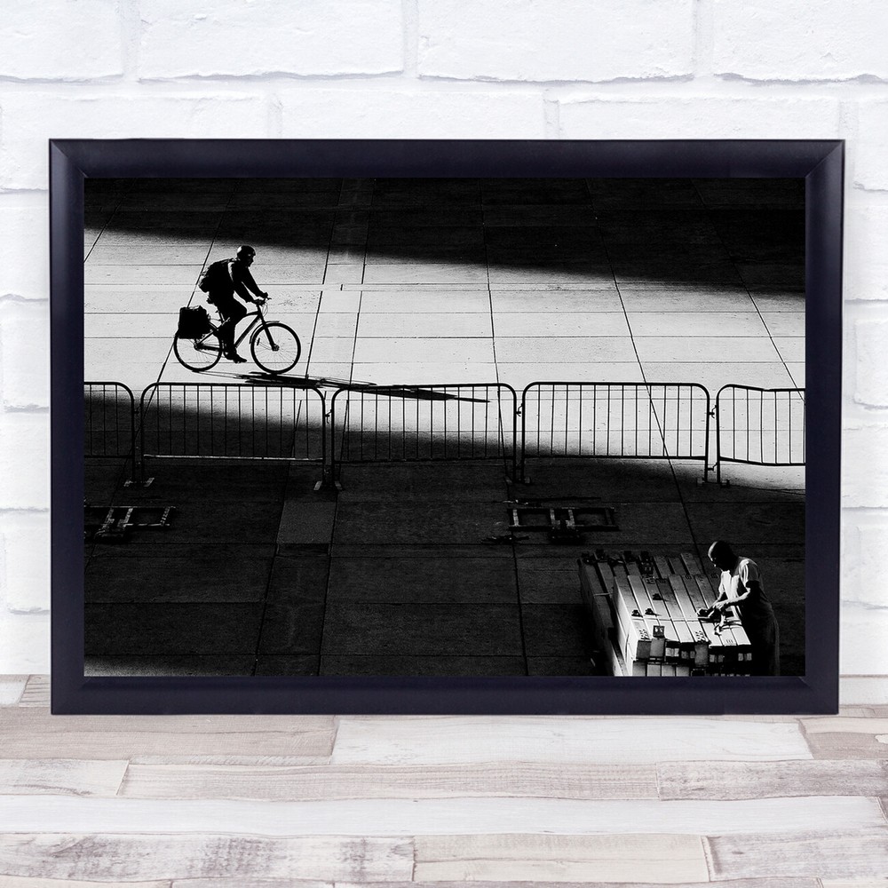 Bright Darkness man on bike in street Wall Art Print