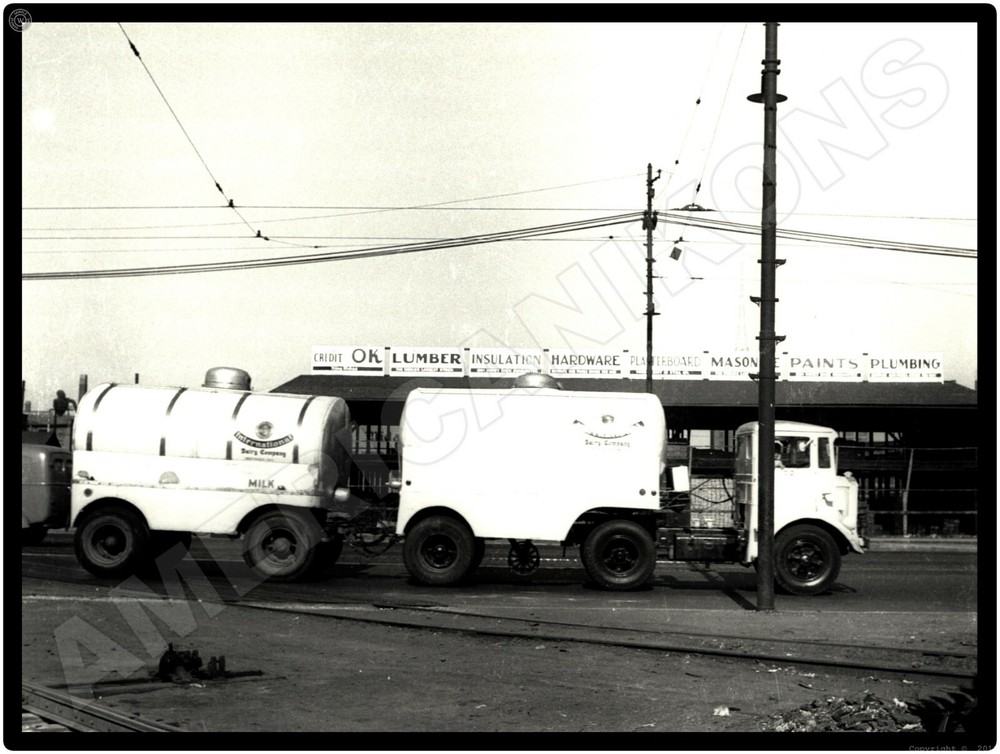 Mack Trucks AC New Metal Sign: 1934 Model CH International Dairy Company Truck