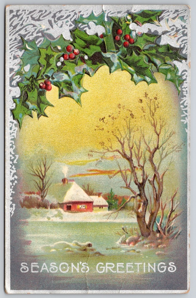 Snowy Winter Cottage in Holly Boughs Season’s Greetings c1909 Embossed Postcard
