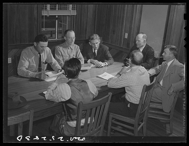 Photo:Men Meeting at Table 1930s Office Conference Discussion
