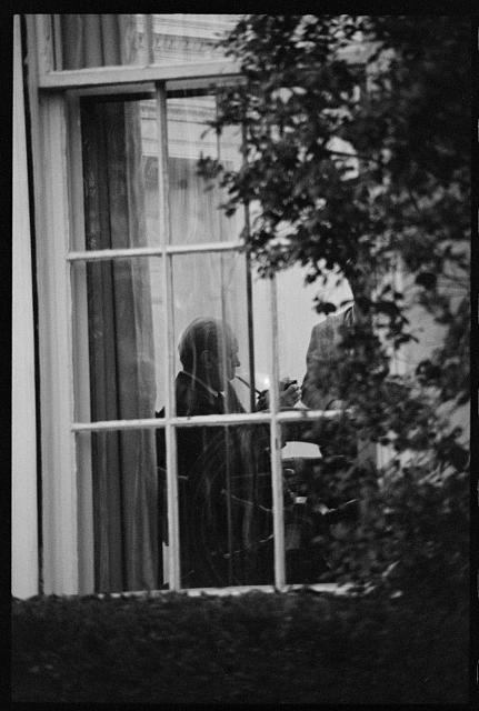 President Gerald Ford smoking a pipe at the White House,Washington,D.C.