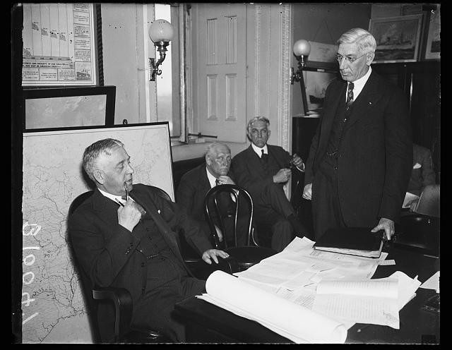 Photo:1936 Railroad Meeting Men in Office Map Documents