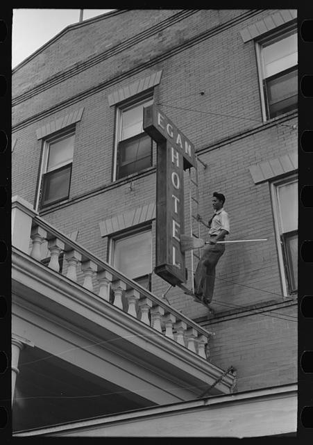 Crowley Louisiana 1938 Egan Hotel sign dusting rice festival preparation