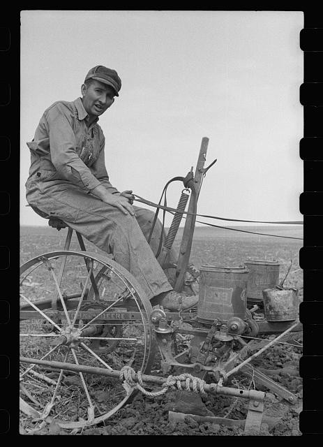 Photo:Monona County Iowa 1940 Man Adjusting Wire on Corn Planter Deere