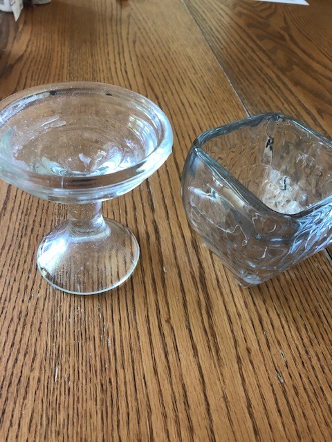 2 clear glass candleholders