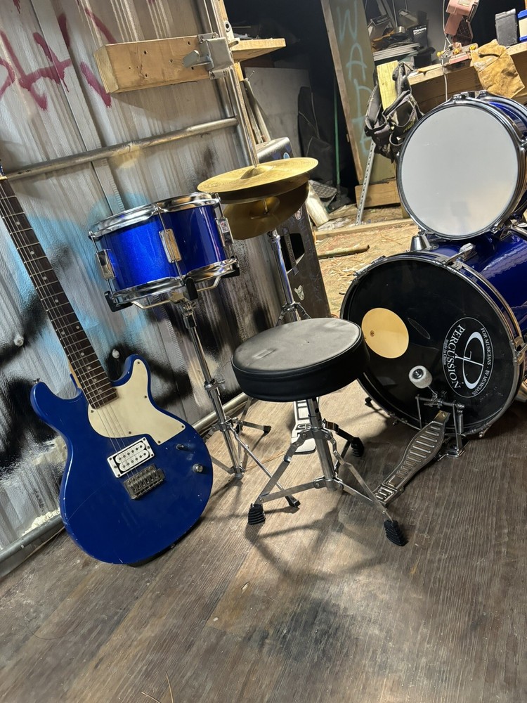 drum set with electric guitar used