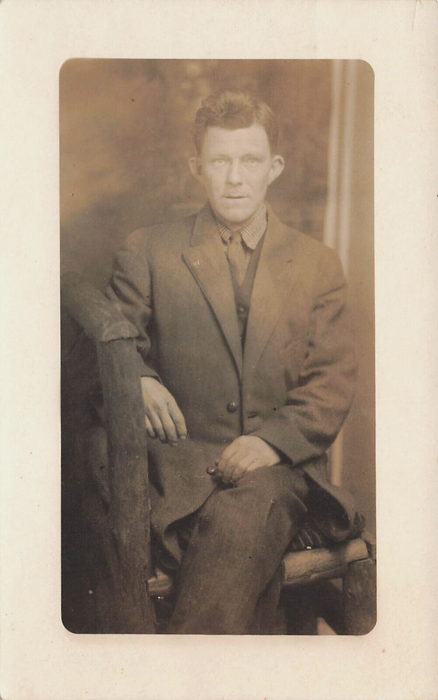 WELL DRESSED MAN SITTING IN CHAIR STUDIO PORTRAIT REAL PHOTO POSTCARD 1910s RPPC