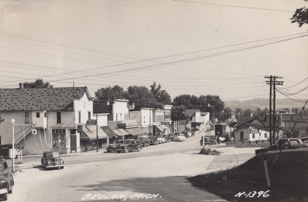 Beulah MI Michigan ~ street scene RPPC 1952 Coca Cola / Philco / Beulah Cafe