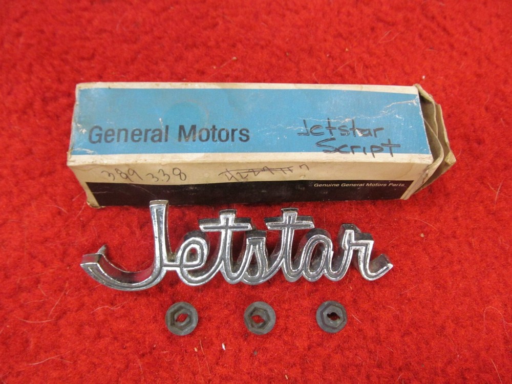 1965 Oldsmobile Jetstar NOS GM Fender Script Emblem # 389338
