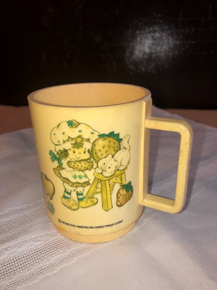 Vintage 80s American Greetings Strawberry Shortcake plastic child's mug.