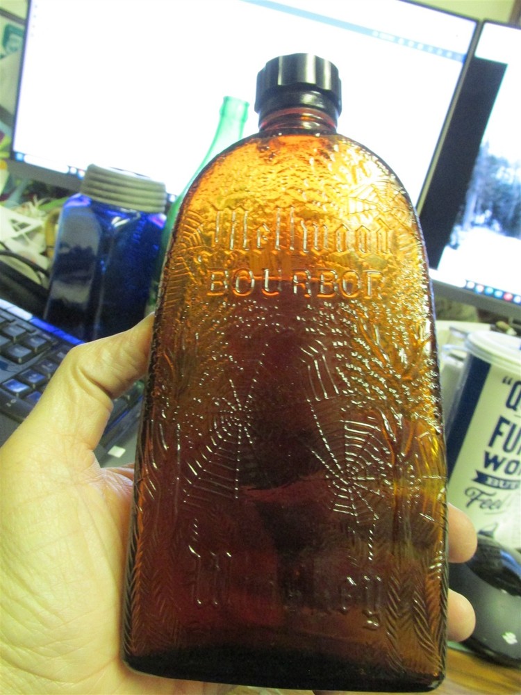 Spiderweb Whiskey bottle amber w/ Mellwood Bourbon Whiskey label