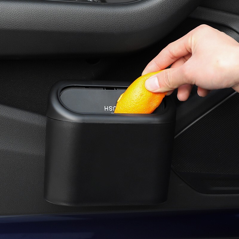 Trash can door-mounted multi-functional storage car interior supplies