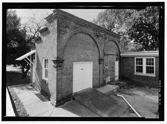 11. Attached Outbuilding South Rear Lodge Building. View Southwest. -