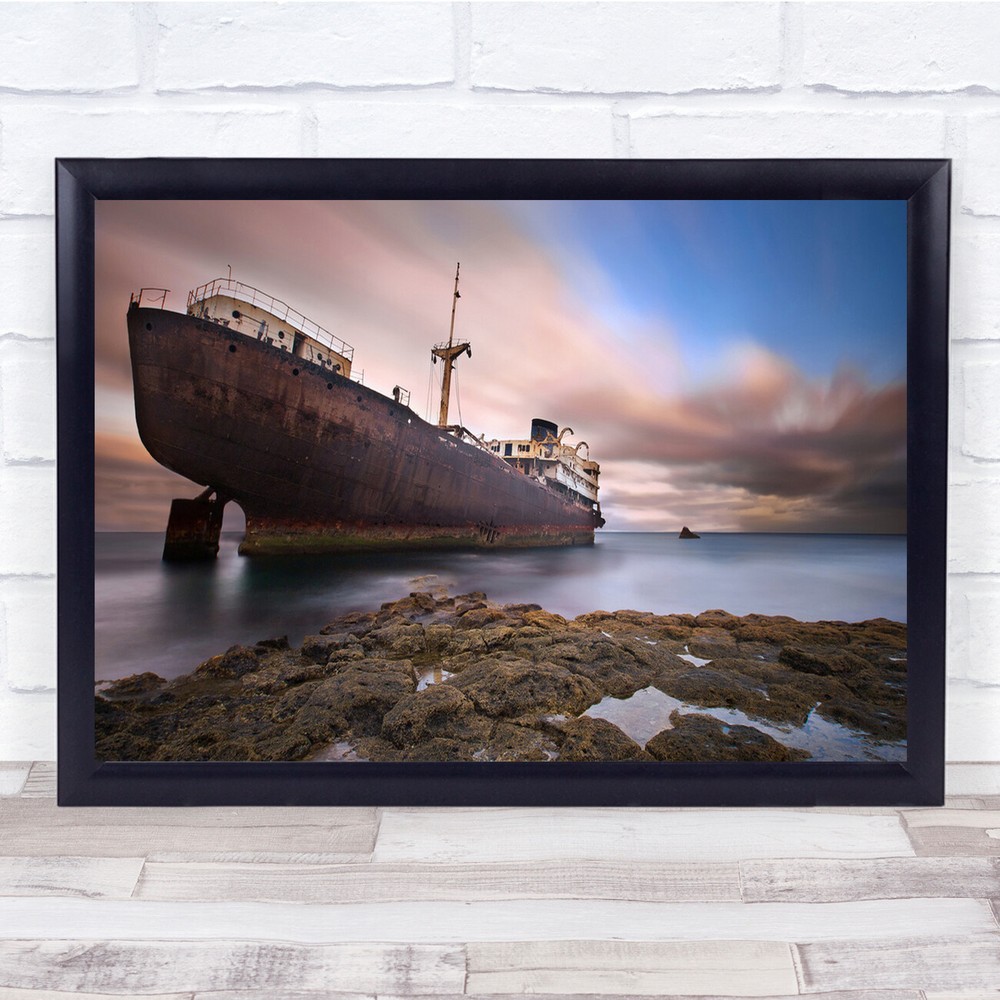 boat stranded sea clouds rocky Wall Art Print