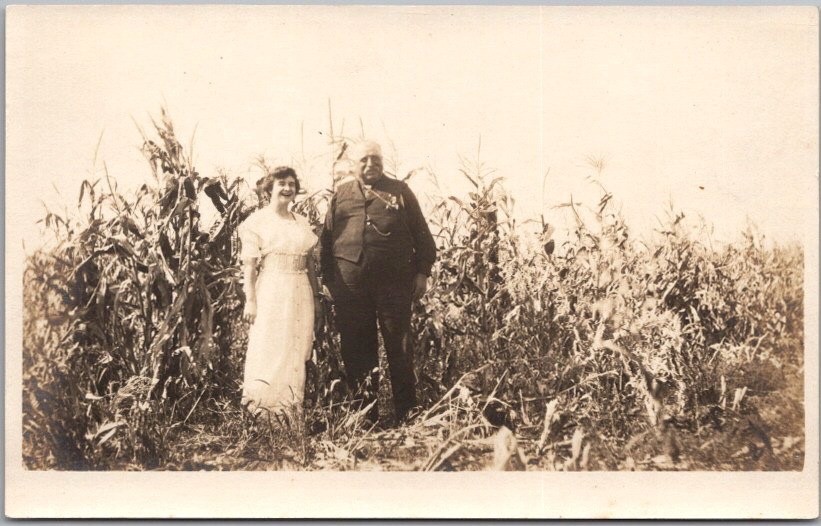 Vintage 1910s Real Photo RPPC Postcard Man & Woman Posing on Edge of Corn Field