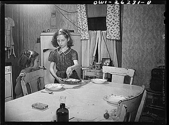 Buffalo, New York. Beverly Ann Grimm, eleven, serving an omelette for Saturday