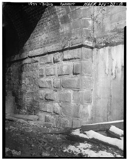 8. East Wall South Portal Showing Stone Entrance Arch Interior Brick Arching. -